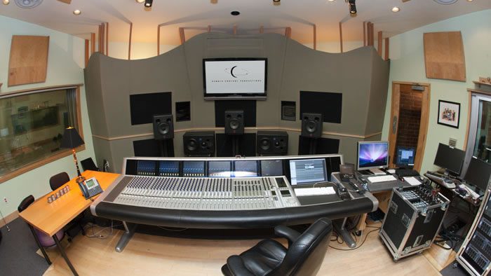 A large recording studio with a big desk